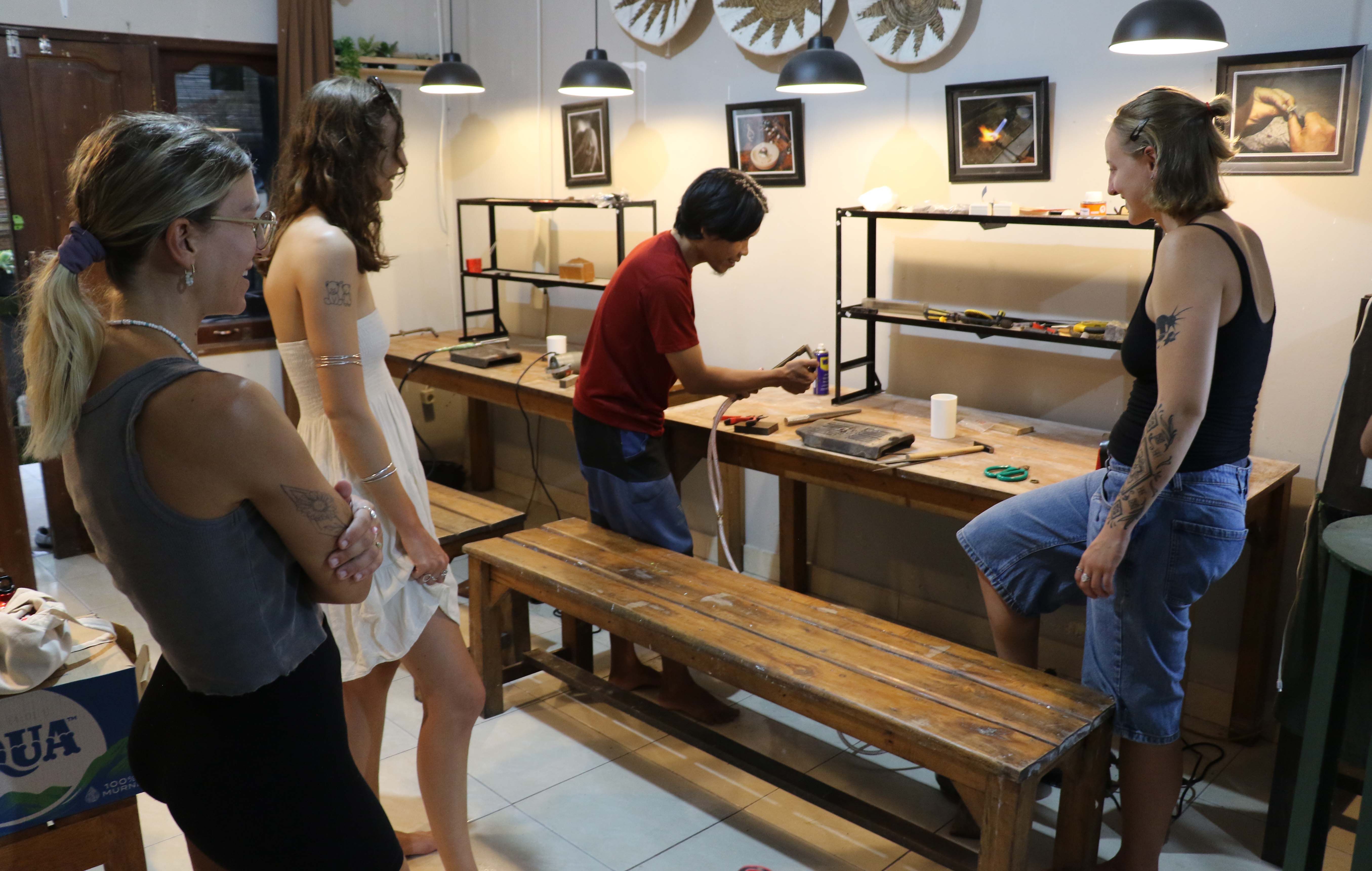 Guests and instructor inside the jewelry workshop